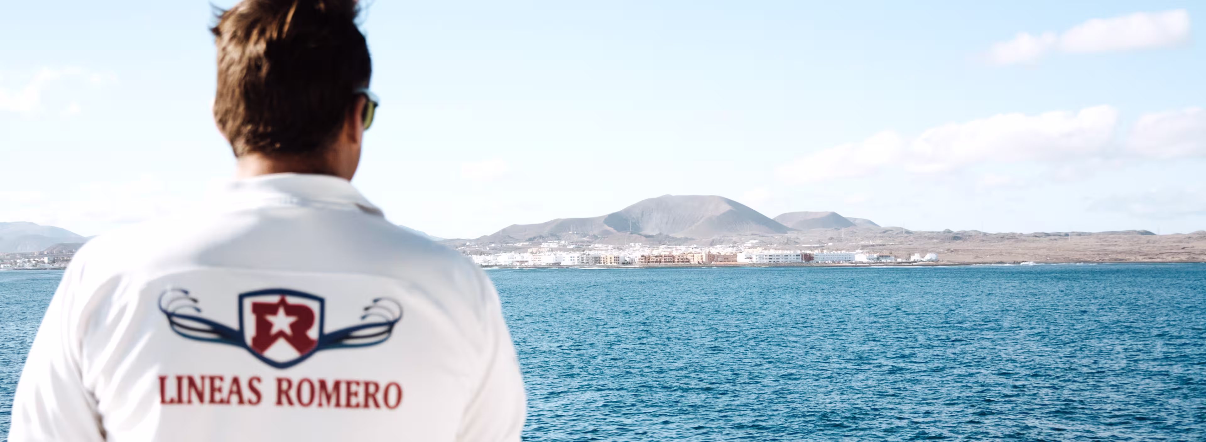Líneas Romero ship captain looking at the horizon where the Corralejo port is located